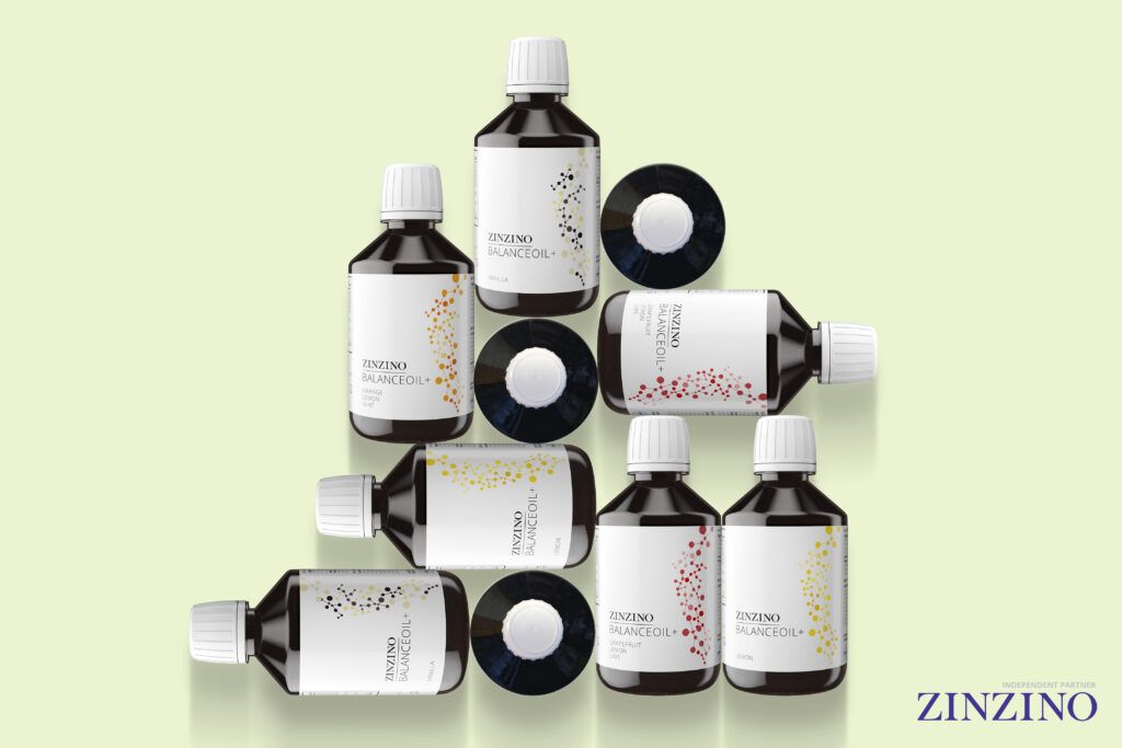 Zinzino BalanceOil bottles stacked in a balanced pyramid, representing stability and Omega-3 support.